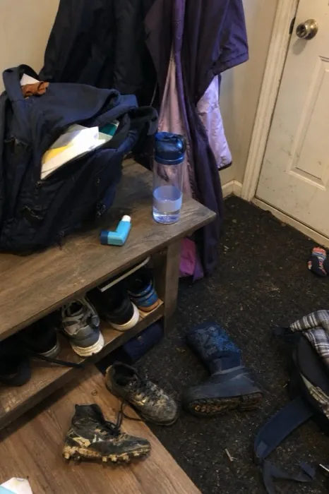 A mudroom bench with kids' gear